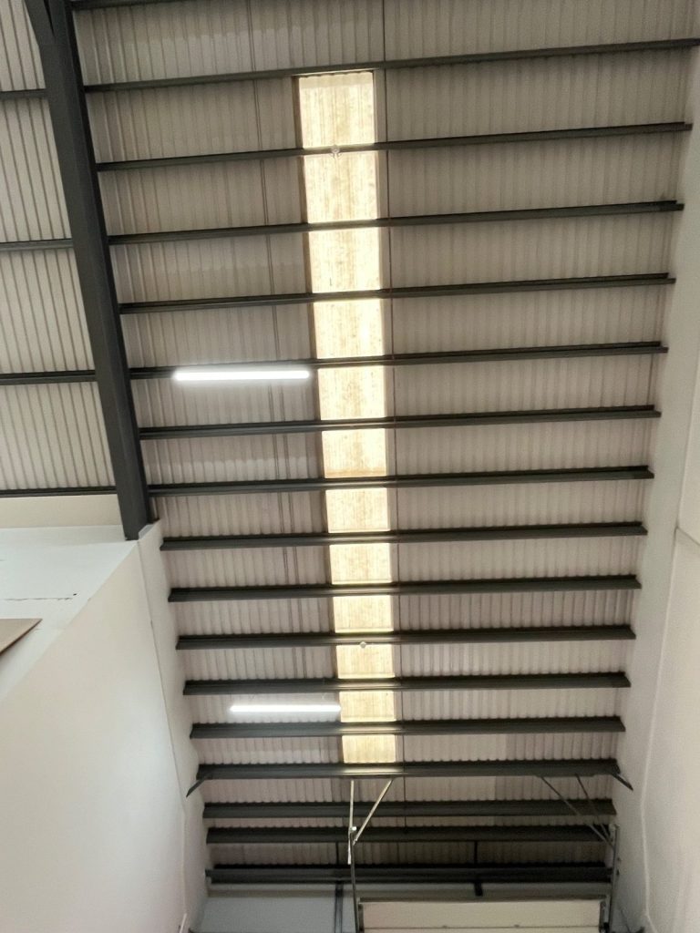 Daylight through a cleaned rooflight seen from inside an industrial unit